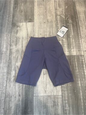 Nike Womens’s One High-Waisted 8” Biker Short with pockets Size XS Purple